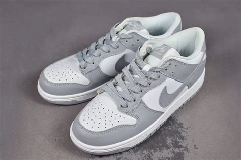 grey and white nike shoes.